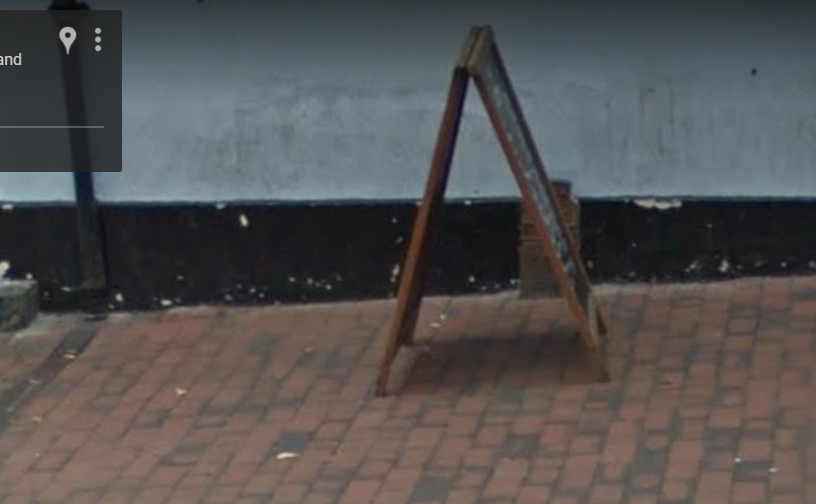 Telegraph cable marker post at 41 High Street, Sittingbourne by StreetView 