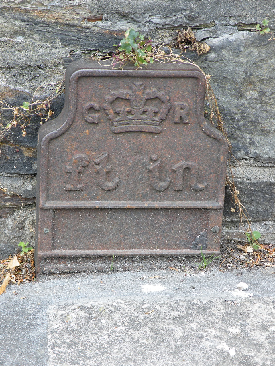 Telegraph cable marker post at outside 2 Russell Street, on Plymouth Road, Tavistock by Mark Fenlon 