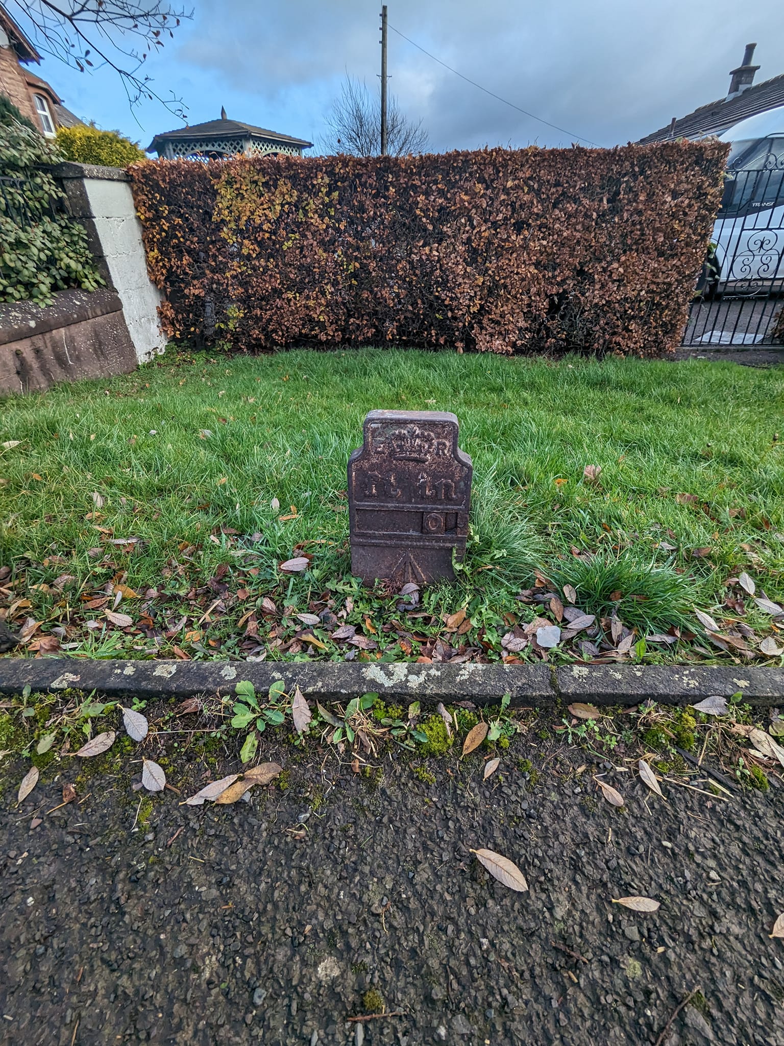 Telegraph cable marker post at 42 Carlisle Road, Lockerbie by Carol Elliott 