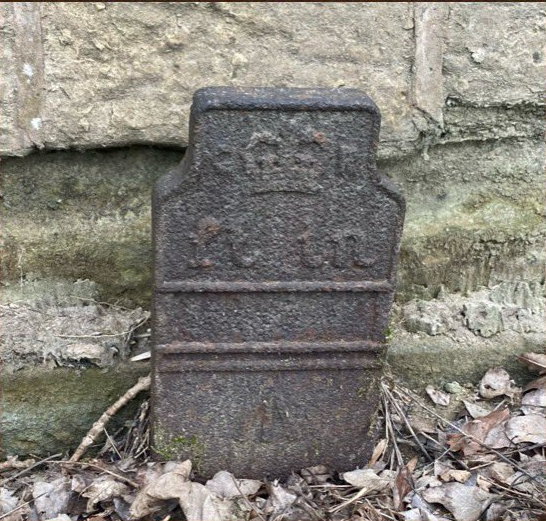 Telegraph cable marker post at By wall, southern end of old gateway, Barnsley Road, Woolley, Wakefield by Hellington Boots 