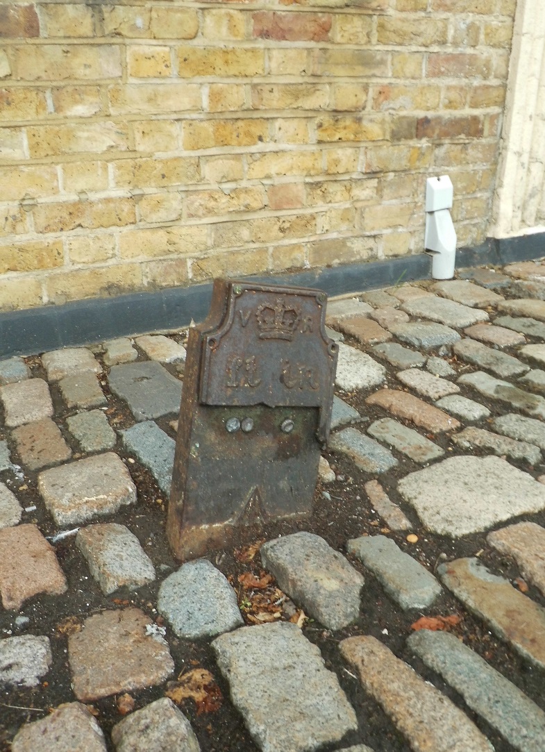 Telegraph cable marker post at 24 High Street, Bushey by Derek Pattenson 