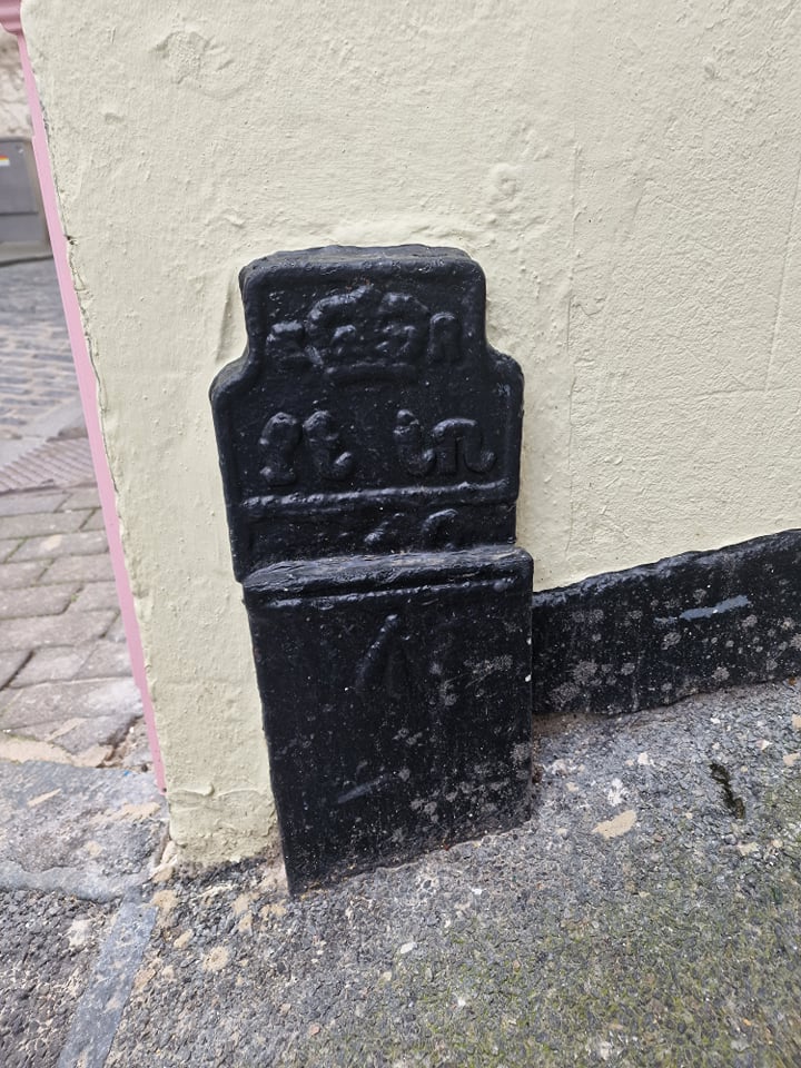 Telegraph cable marker post at jnc. The Pollet and Forest Lane, St Peter Port, Guernsey by Moores Hotel 