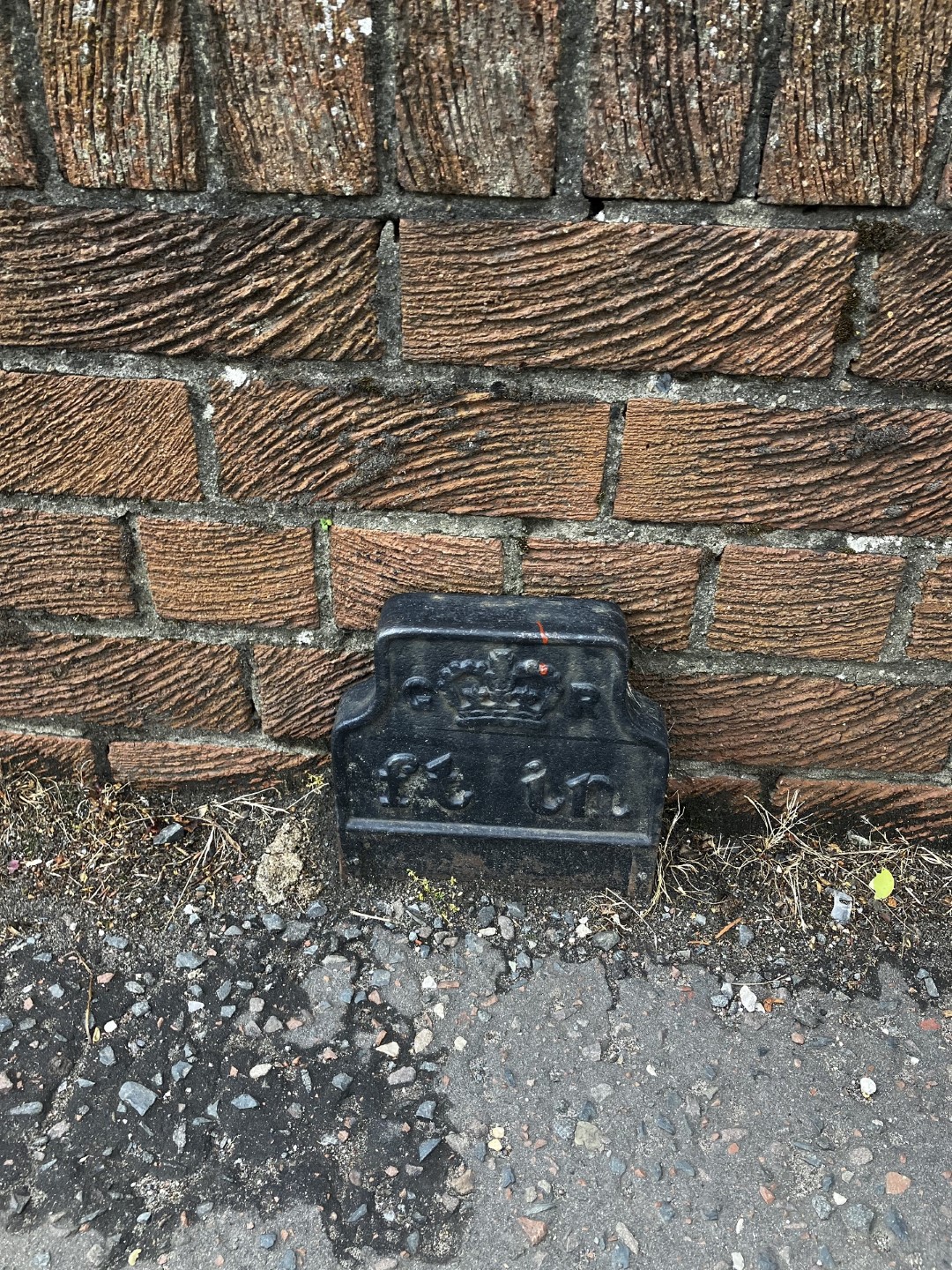 Telegraph cable marker post at 89 East Main Street, Whitburn, West Lothian by Riley McNulty 